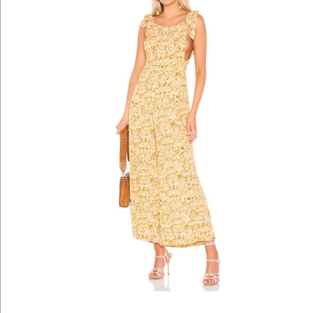 FREE PEOPLE Sugar Sands Wide Leg Jumpsuit In Honey‎ sold by Revolve